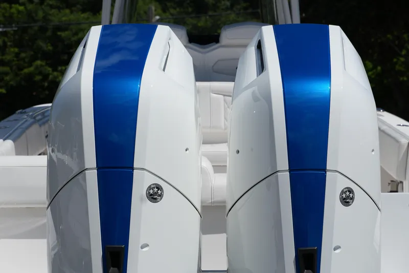  Yacht Photos Pics 2023 Fountain 34 Center Console boat engines with blue accents, rear view.