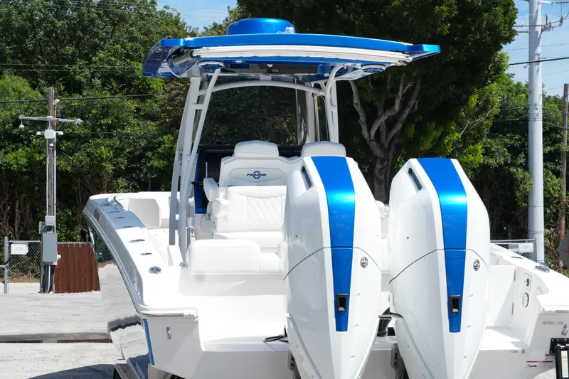  Yacht Photos Pics 2023 Fountain 34 Center Console boat with dual engines, blue accents, and sleek design.