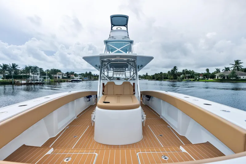  Yacht Photos Pics 2025 Freeman LR boat on a serene waterway, featuring spacious deck and modern design.