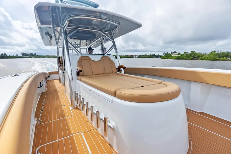  Yacht Photos Pics 2025 Freeman LR boat with tan seating and sleek design on a calm waterway.