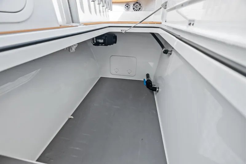  Yacht Photos Pics Interior view of 2025 Freeman LR boat storage compartment, featuring clean white finish.
