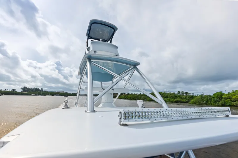  Yacht Photos Pics 2025 Freeman LR boat with tower and LED light bar on a river.