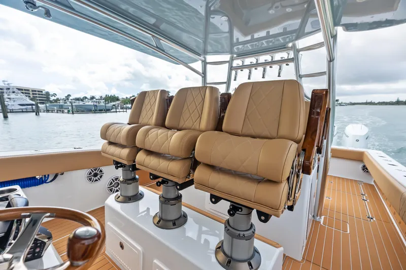  Yacht Photos Pics Luxurious seating on 2025 Freeman LR boat with tan leather chairs and sleek design.