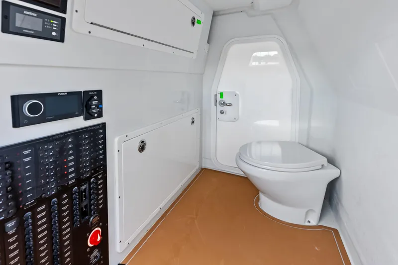  Yacht Photos Pics Interior of 2025 Freeman LR boat with control panels and modern toilet.
