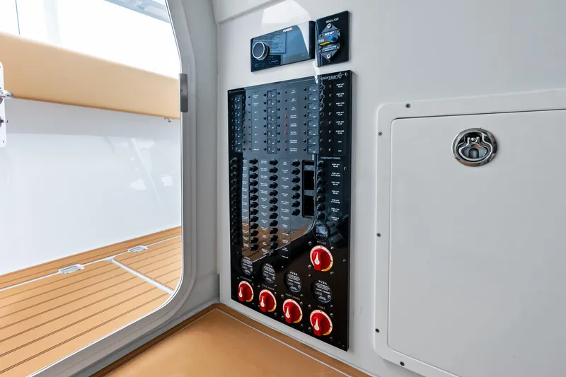  Yacht Photos Pics Control panel inside 2025 Freeman LR boat, featuring switches and dials on a sleek interior.