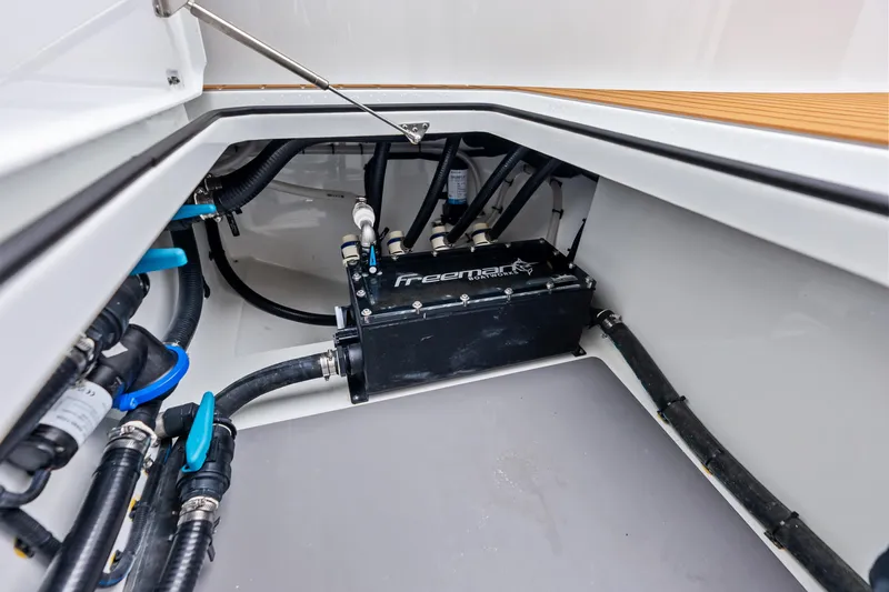  Yacht Photos Pics 2025 Freeman LR boat compartment with control box and plumbing components.