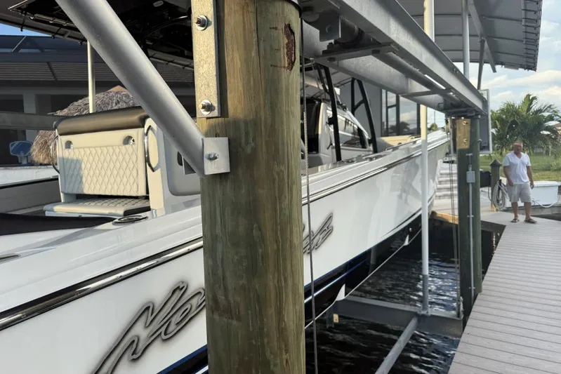  Yacht Photos Pics 2025 Nor-Tech 390 Sport Center Console docked, featuring sleek design and luxurious seating.