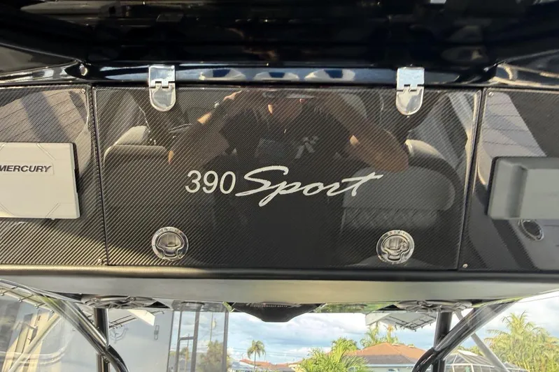  Yacht Photos Pics 2025 Nor-Tech 390 Sport Center Console dashboard with carbon fiber finish and Mercury branding.