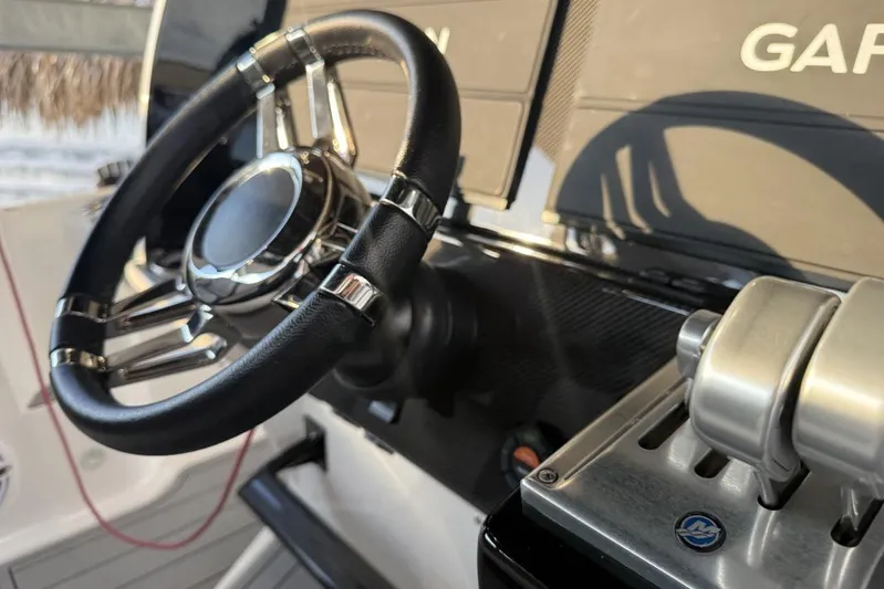  Yacht Photos Pics 2025 Nor-Tech 390 Sport Center Console steering wheel and controls, featuring Garmin technology.