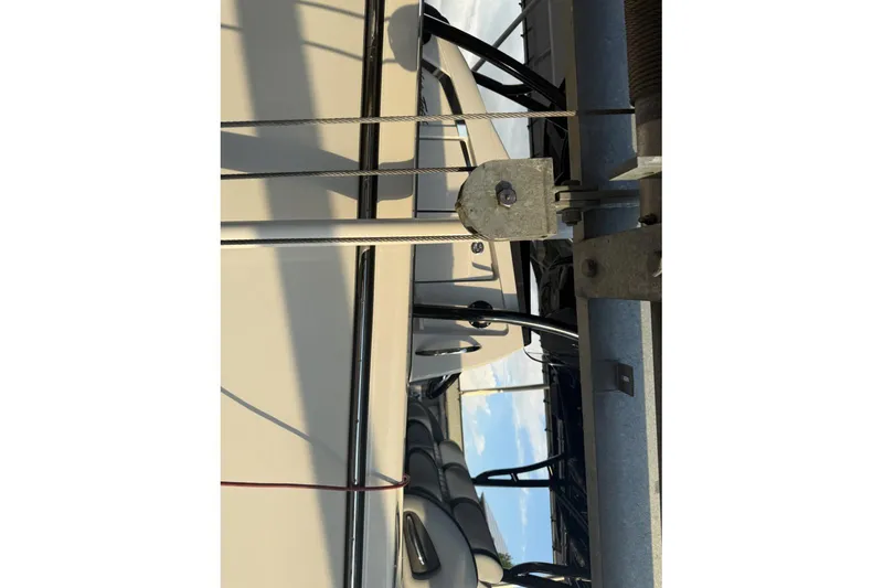  Yacht Photos Pics 2025 Nor-Tech 390 Sport Center Console boat on a lift, showcasing sleek design.