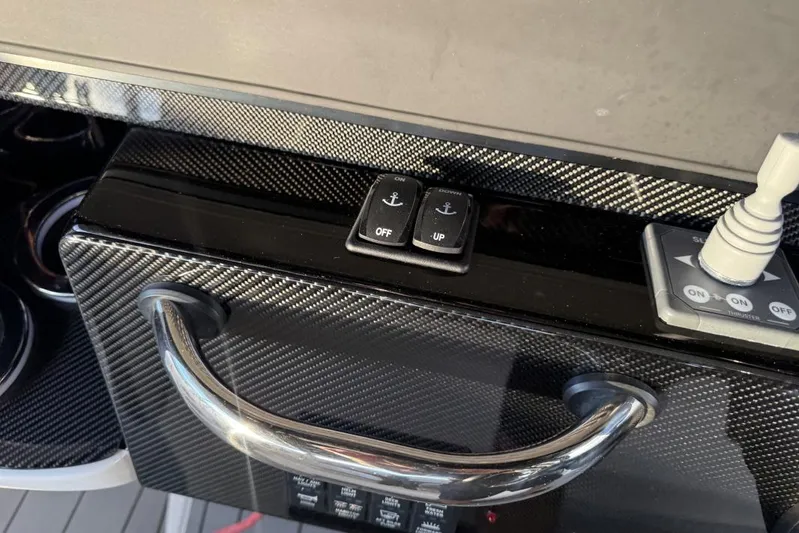  Yacht Photos Pics Control panel of 2025 Nor-Tech 390 Sport Center Console with carbon fiber finish.