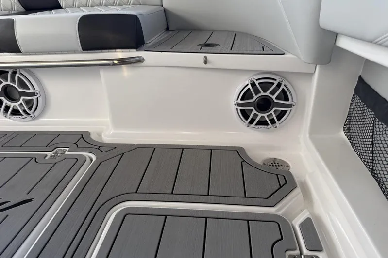  Yacht Photos Pics 2025 Nor-Tech 390 Sport Center Console interior with speakers and cushioned seating.