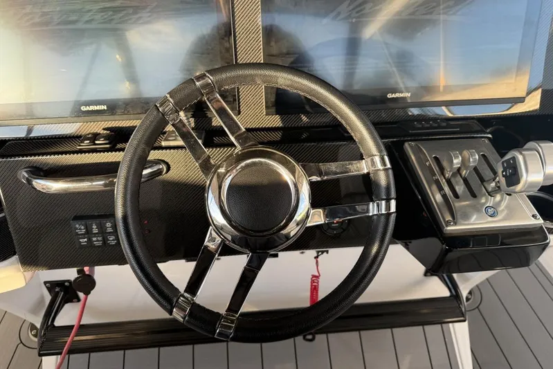  Yacht Photos Pics Steering wheel and controls of 2025 Nor-Tech 390 Sport Center Console boat.