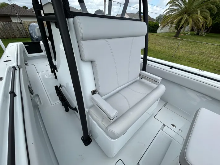  Yacht Photos Pics 2024 Contender 28 Tournament boat with sleek white seating and modern design.