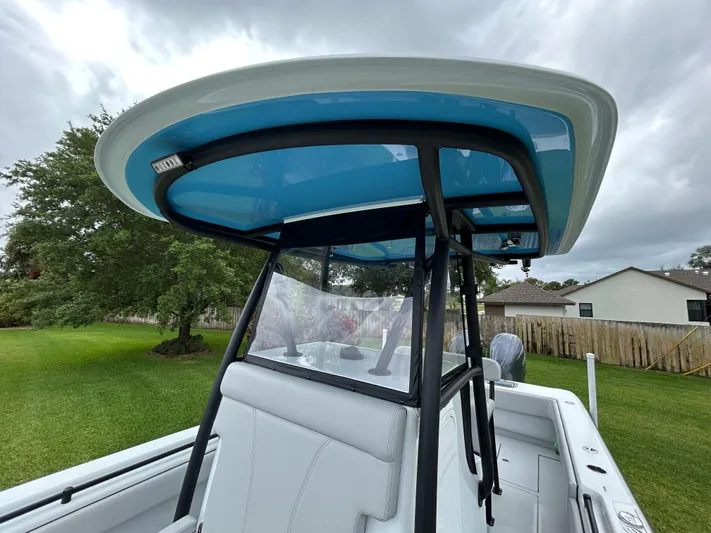  Yacht Photos Pics 2024 Contender 28 Tournament boat with blue T-top and sleek design.