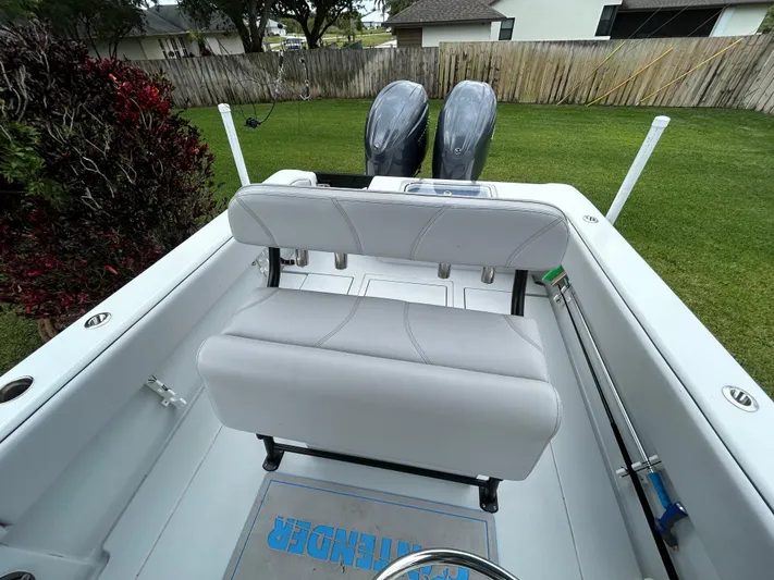  Yacht Photos Pics 2024 Contender 28 Tournament boat with dual engines and cushioned seating, parked on grass.