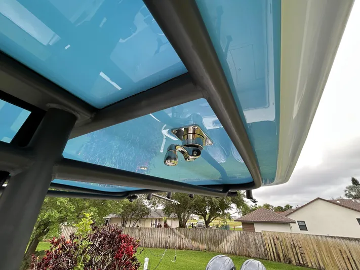  Yacht Photos Pics 2024 Contender 28 Tournament boat with blue undercarriage and metal fixtures.