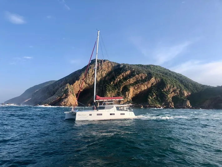 Vision 444 Yacht Photos Pics Sailboat Vision 444 cruising near rocky coastline, clear skies, 2026 model.