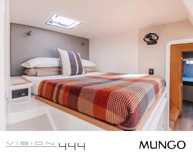 Vision 444 Yacht Photos Pics Cozy cabin interior of Vision 444 yacht, featuring a plaid bedspread and modern design, 2026 model.