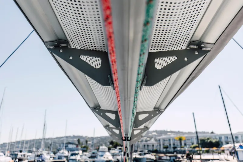 Vision 444 Yacht Photos Pics Underneath view of Vision 444 sailboat mast, 2026 model, with marina background.