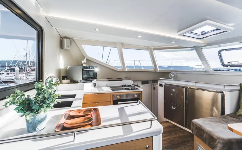 Vision 444 Yacht Photos Pics Modern yacht kitchen interior with sleek design, stainless appliances, and panoramic windows. Vision 444, 2026 model.