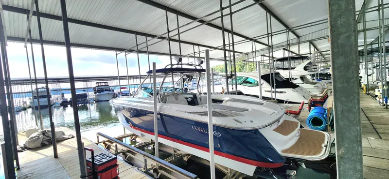  Yacht Photos Pics 2007 Cobalt 343 boat docked in a marina, surrounded by other boats.