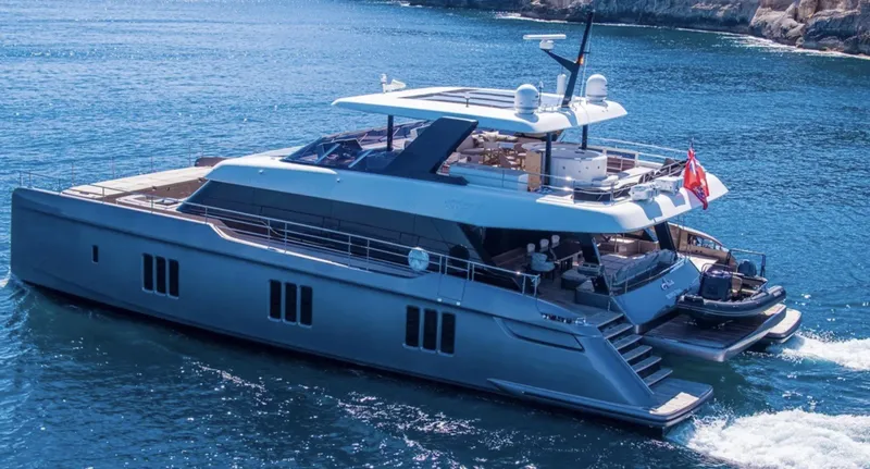 Ellen's Dream Yacht Photos Pics Luxurious 2020 Sunreef 80 Power yacht cruising on clear blue waters.