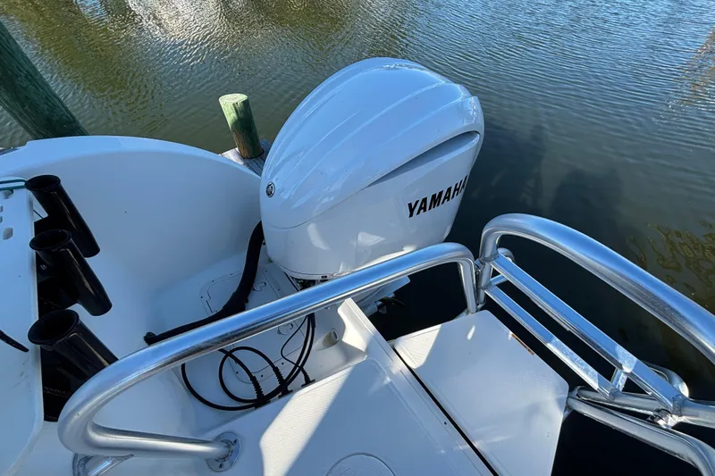  Yacht Photos Pics 2023 World Cat 295 CC boat with Yamaha outboard engine on calm water.