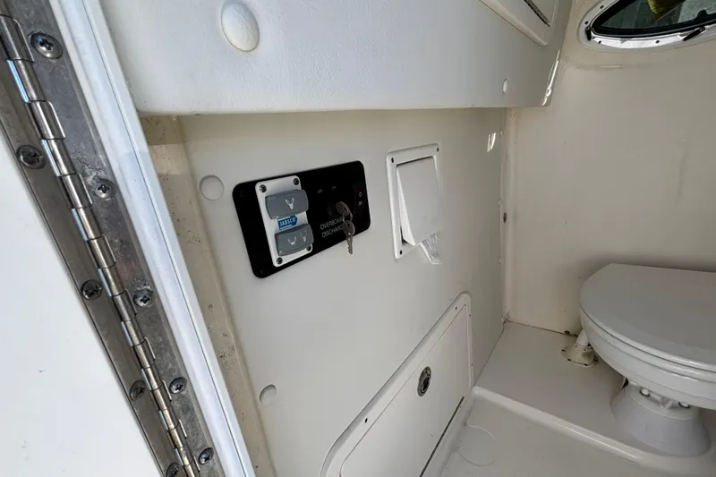  Yacht Photos Pics Interior of 2023 World Cat 295 CC boat featuring a compact marine toilet.