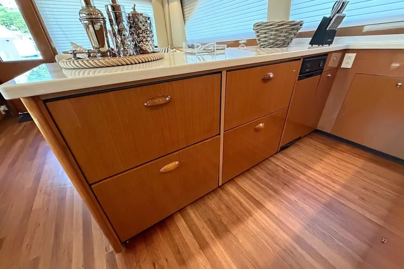 Breakaway Yacht Photos Pics 2004 Viking 56 Convertible yacht interior with wooden cabinetry and modern decor.