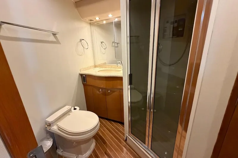 Breakaway Yacht Photos Pics Bathroom interior of 2004 Viking 56 Convertible yacht with shower and toilet.
