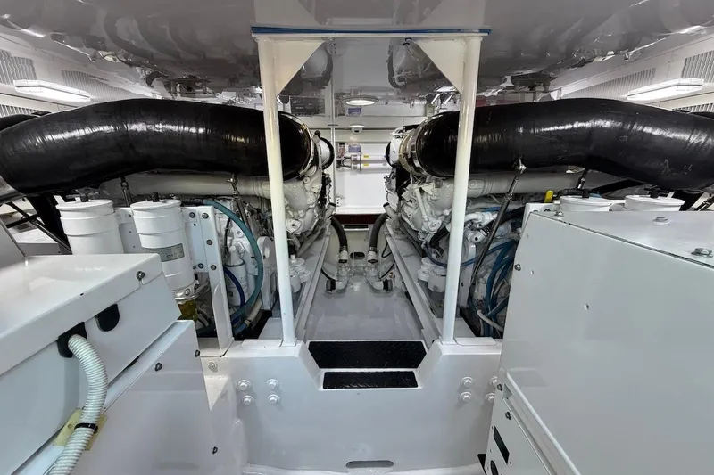 Breakaway Yacht Photos Pics Engine room of a 2004 Viking 56 Convertible yacht, showcasing dual engines and mechanical components.