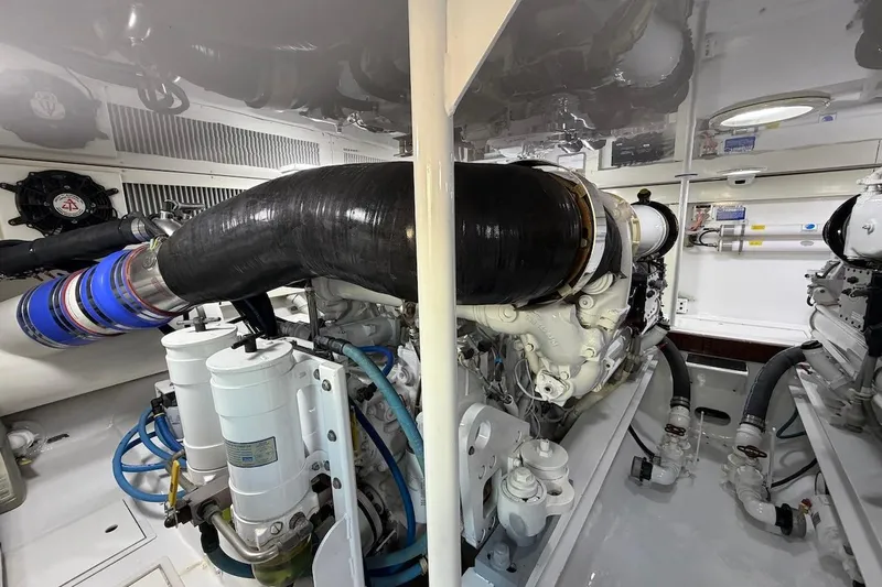 Breakaway Yacht Photos Pics Engine room of a 2004 Viking 56 Convertible yacht, showcasing detailed machinery.