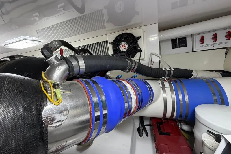 Breakaway Yacht Photos Pics Engine room of a 2004 Viking 56 Convertible yacht, showcasing pipes and fittings.