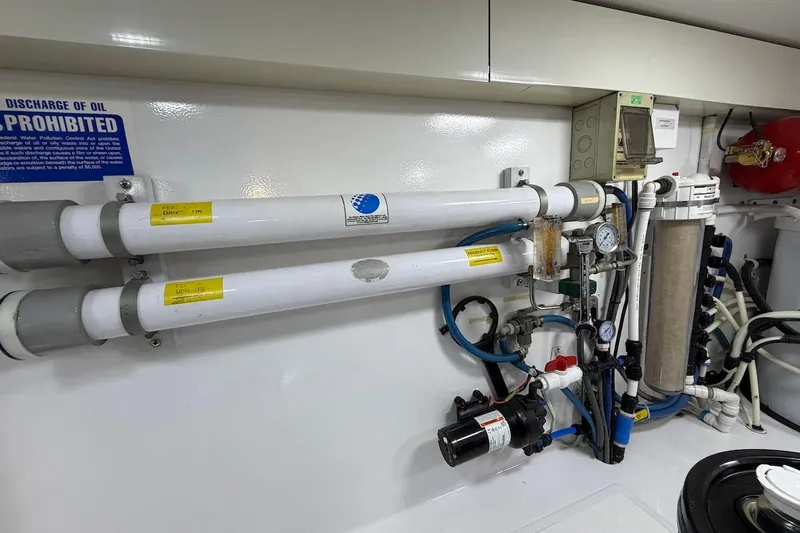 Breakaway Yacht Photos Pics Engine room of 2004 Viking 56 Convertible yacht with complex piping and filtration system.