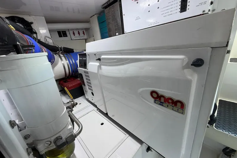 Breakaway Yacht Photos Pics Engine room of 2004 Viking 56 Convertible with Onan generator and mechanical components.