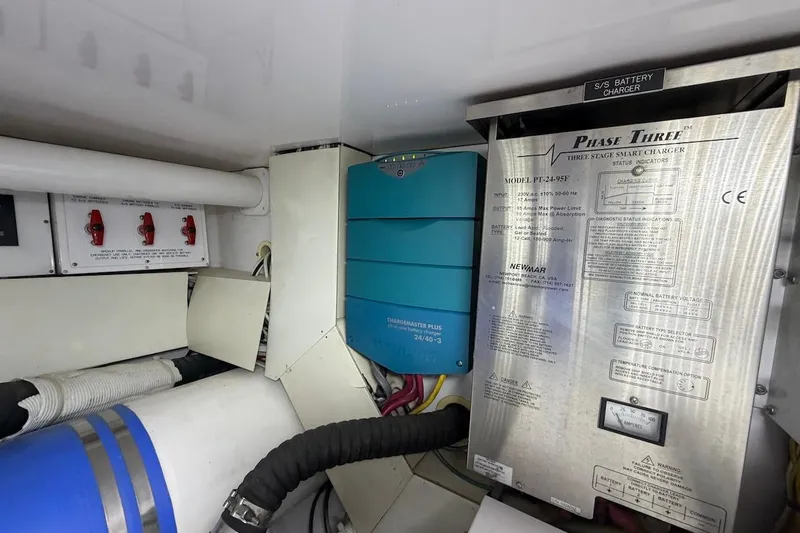 Breakaway Yacht Photos Pics Engine room of 2004 Viking 56 Convertible with battery charger and electrical components.