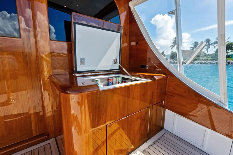 Nic-nac Yacht Photos Pics Luxurious 1977 Merritt Sportfish yacht interior with polished wood and built-in cooler.