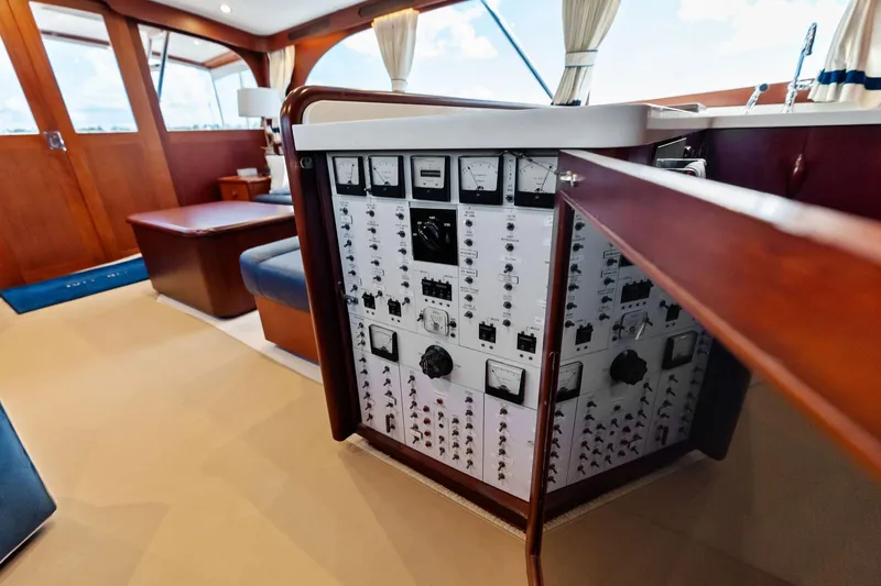 Nic-nac Yacht Photos Pics Interior of a 1977 Merritt Sportfish yacht showing control panel and seating area.
