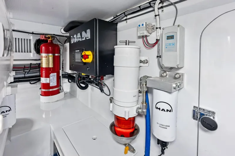 Nic-nac Yacht Photos Pics Engine room of 1977 Merritt Sportfish with fire extinguisher and MAN equipment.