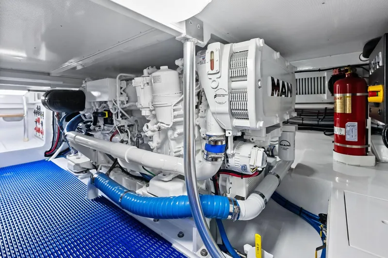 Nic-nac Yacht Photos Pics Engine room of a 1977 Merritt Sportfish boat with MAN engine and fire extinguisher.