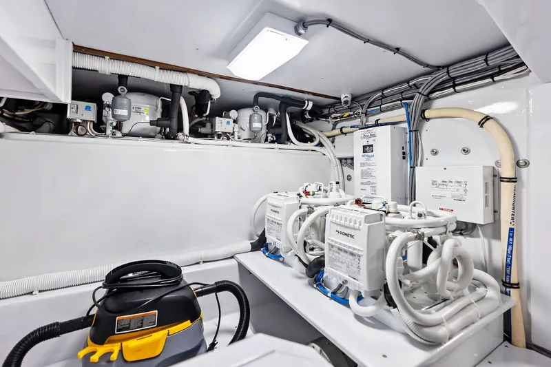 Nic-nac Yacht Photos Pics 1977 Merritt Sportfish engine room with modern equipment and wiring.