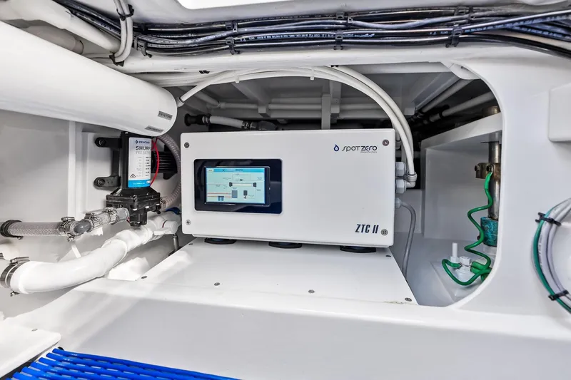 Nic-nac Yacht Photos Pics Engine room of a 1977 Merritt Sportfish boat with modern equipment and wiring.