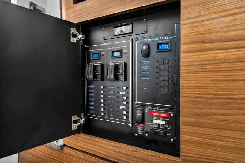  Yacht Photos Pics Electrical control panel inside 2023 Boston Whaler 350 Realm boat, featuring various switches and displays.