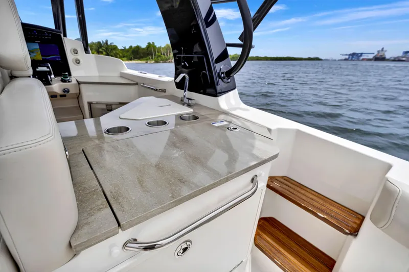  Yacht Photos Pics 2023 Boston Whaler 350 Realm interior with sleek countertop and ocean view.