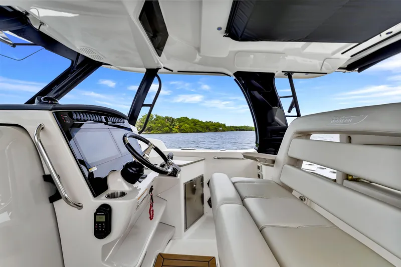  Yacht Photos Pics Interior of 2023 Boston Whaler 350 Realm boat with modern helm and seating.