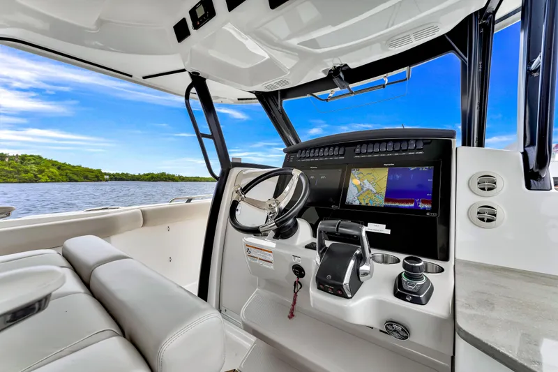  Yacht Photos Pics 2023 Boston Whaler 350 Realm helm with advanced navigation displays and luxurious seating.