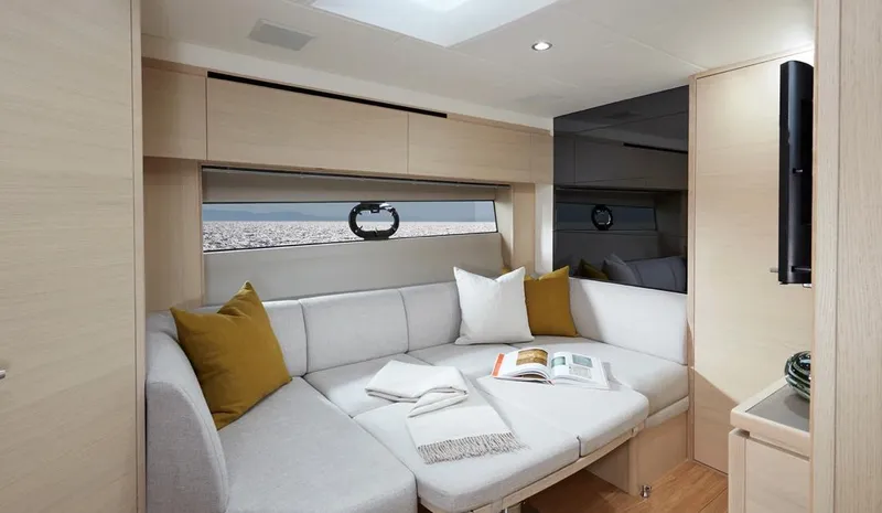  Yacht Photos Pics Luxurious interior of 2025 Princess V40 yacht with cozy seating and ocean view.