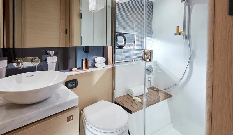  Yacht Photos Pics Luxurious bathroom in 2025 Princess V40 yacht with modern fixtures and elegant design.