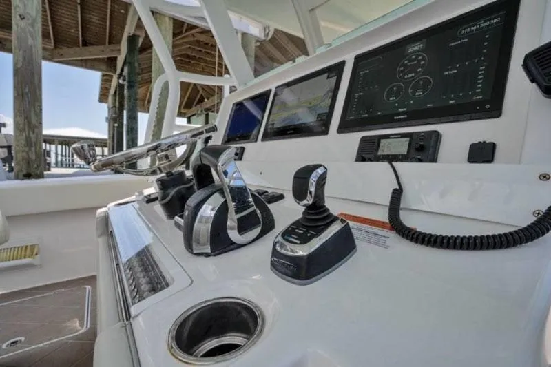  Yacht Photos Pics Control panel of a 2020 Invincible 37' Catamaran with advanced navigation systems.